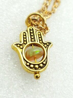 Hasma hand and opal crystal necklace